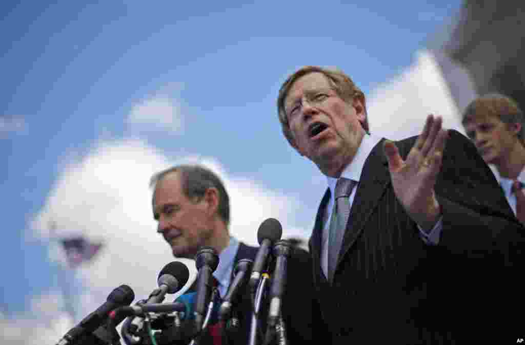 Plaintiff attorneys Theodore Olson, right, and David Boies, meet with the media outside the Supreme Court in Washington after the court heard arguments on California's Proposition 8, March 26, 2013.