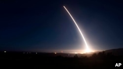 FILE photo provided by US Air Force - an unarmed Minuteman III intercontinental ballistic missile launches during an operational test at Vandenberg Air Force Base, Calif. 