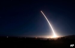FILE - An unarmed Minuteman III intercontinental ballistic missile launches during an operational test at Vandenberg Air Force Base, Calif., in this photo provided by the US Air Force.