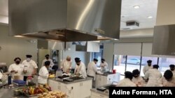 Trainees at the Hospitality Training Academy make meals for seniors, part of a Los Angeles-area program that is funded, in part, by the American Rescue Plan and the CARES Act.(Courtesy Adine Forman, HTA)