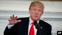 President Donald Trump speaks during a meeting with the members of the National Governors Association in the State Dining Room of the White House, Monday, Feb. 26, 2018, in Washington. 