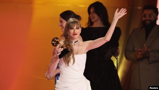 Taylor Swift accepts the award for Album of the Year for Midnights during the 66th Annual Grammy Awards in Los Angeles, Feb. 4, 2024.