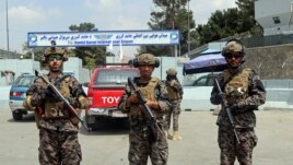 Taliban special forces fighters stand guard outside the Hamid Karzai International Airport after the U.S. military's withdrawal, in Kabul, Afghanistan, Tuesday, Aug. 31, 2021