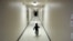 FILE - A boy who was detained with migrants at the U.S.-Mexico border runs down a hallway after arriving from an immigration detention center at a shelter in San Diego, California, Dec. 11, 2018.