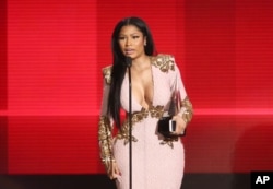 Nicki Minaj accepts the award for favorite album - rap/hip-hop for “The Pinkprint” at the American Music Awards at the Microsoft Theater on Nov. 22, 2015, in Los Angeles.