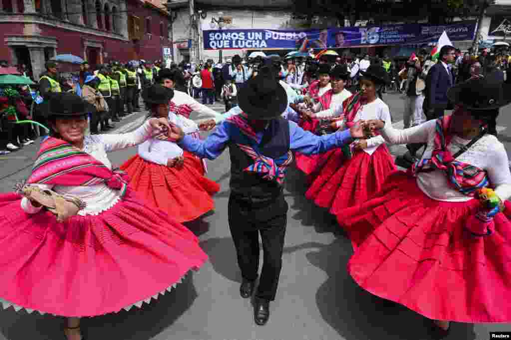 People from social organizations dance in commemoration of the Plurinational State Day, in La Paz, Bolivia.