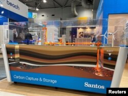 FILE - View of a model of carbon capture and storage designed by Santos Ltd. at the Australian Petroleum Production and Exploration Association conference in Brisbane, Australia, on May 18, 2022.