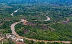 FILE - Aerial view of La Penita indigenous village, Darien province, Panama, May 23, 2019. Migrants cross the border between Colombia and Panama through the Darien Gap on their way to the United States.