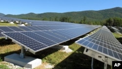 A portion of the Stafford Hill solar power project gathers energy from the sun in Rutland, Vt., on Tuesday, Sept. 15, 2015. 