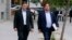 Fired Catalan vice president Oriol Junqueras, right, arrives at the national court in Madrid, Nov. 2, 2017. Some of the 14-member ousted Catalan Cabinet were expected to appear before a judge in Madrid for questioning as part of a rebellion inquiry.