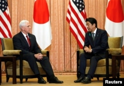U.S. Vice President Mike Pence (L) talks with Japan's Prime Minister Shinzo Abe at Abe's official residence in Tokyo, April 18, 2017.