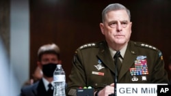 Chairman of the Joint Chiefs of Staff Gen. Mark Milley attends a Senate Armed Services Committee hearing on the conclusion of military operations in Afghanistan and plans for future counterterrorism operations, on Capitol Hill, Sept. 28, 2021.