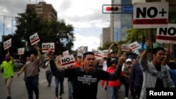 Supporters of Venezuelan opposition leader and self-proclaimed interim president Juan Guaido take part in a protest against Venezuelan President Nicolas Maduro's government in Caracas, Venezuela, Jan. 30, 2019. 