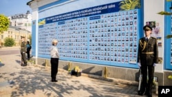 Ursula von der Leyen, president of the European Commission, stands in front of the memorial for Ukrainian soldiers killed in the war against Russia's invasion, in Kyiv on Sept. 20, 2024. Von der Leyen also announced a loan of $39 billion to help rebuild Ukraine's energy grid.