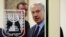 FILE - Israeli Prime Minister Benjamin Netanyahu is seen through a glass door in Jerusalem Oct. 7, 2013. 