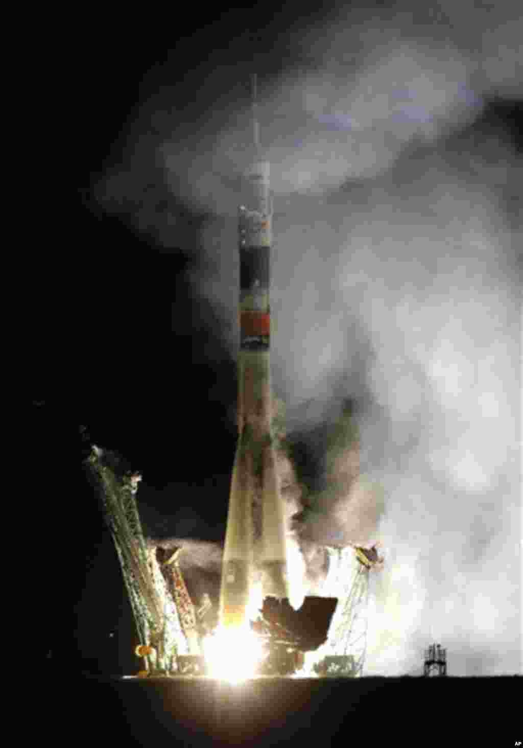The Soyuz-FG rocket booster with Soyuz TMA-01M space ship carrying a new crew to the International Space Station, ISS, blasts off from the Russian leased Baikonur cosmodrome, Kazakhstan, early Friday, Oct. 8, 2010. The Russian rocket carries US astronaut