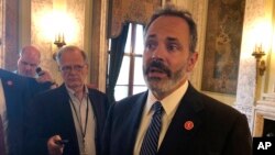 Kentucky Gov. Matt Bevin speaks with reporters about a new report detailing an increase in drug overdose deaths, July 25, 2018, in Frankfort, Ky.