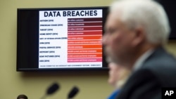 FILE - A chart of data breaches is shown on Capitol Hill in Washington, June 16, 2015.