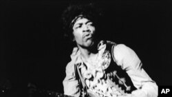 FILE - American rock guitarist Jimi Hendrix performing with The Jimi Hendrix Experience at the Monterey Pop Festival, California, USA, June 18, 1967.