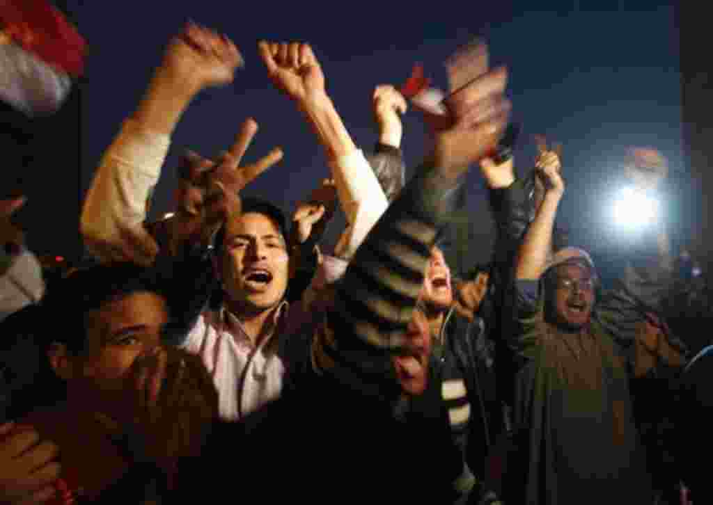 Egyptian citizens celebrate after President Hosni Mubarak resigned and handed power to the military at Tahrir square, in Cairo, Egypt, Friday, Feb. 11, 2011. Egypt exploded with joy, tears, and relief after pro-democracy protesters brought down President