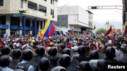 Opposition supporters clash with police during protests against unpopular leftist President Nicolas Maduro in San Cristobal, Venezuela, April 19, 2017. 