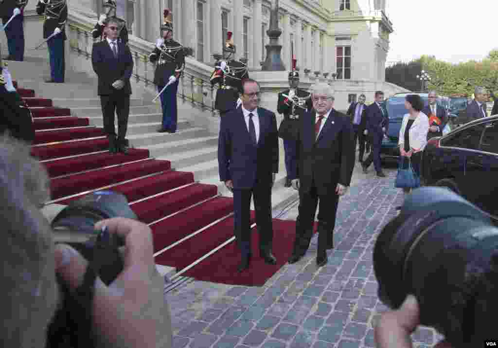 French President Francois Hollande (left) arrives with Iraqi President Fouad Massoum for a conference to strategize the battle against the Islamic State militants, at the French Foreign Ministry in Paris, Sept. 15, 2014.