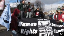 Zully Palacios Rodriguez, a member of the immigrant advocacy group Migrant Justice, speaks to a crowd outside the federal court in Burlington, Vt., Nov. 14, 2018. 