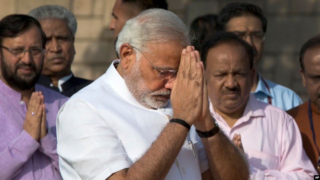 Indian Prime Minister-designate and Hindu nationalist Bharatiya Janata Party leader Narendra Modi pays his respects at Rajghat, the memorial of Mahatma Gandhi, in New Delhi, May 26, 2014.