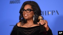 Oprah Winfrey poses in the press room with the Cecil B. DeMille Award at the 75th annual Golden Globe Awards at the Beverly Hilton Hotel on Jan. 7, 2018, in Beverly Hills, California.