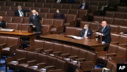 In this image from video, Rep. Kevin Brady, R-Texas., recognizes Rep. Steve Chabot, R-Ohio, left, to speak on the floor of the House of Representatives at the U.S. Capitol in Washington, April 23, 2020.