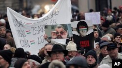 Thousands of protesters demonstrate against the Hungarian government in front of the parliament building in Budapest, December 23, 2011