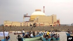 Local fishermen hold black flags during an anti-nuclear protest outside a Russian-built nuclear plant in Kudankalam region, in the southern Indian state of Tamil Nadu, November 21, 2011.