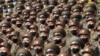 FILE - Soldiers wearing face masks to help cut coronavirus transmission rally to welcome the 8th Congress of the Workers' Party of Korea at Kim Il Sung Square in Pyongyang, North Korea, Oct 12, 2020. 
