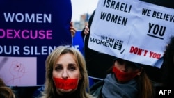 FILE - Demonstrators at a rally organised by the Rape is Rape committee to "denounce the silence of international and feminist organisations" on rapes committed during the attack of October 7, 2023 on Israel, in front of Unesco headquarters in Paris on December 1, 2023. 
