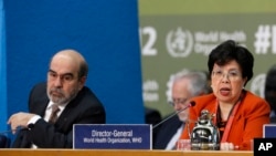 Margaret Chan, WHO director general, is flanked by FAO director general Jose Graziano da Silva as she speaks during the opening session of FAO's second International Conference on Nutrition, in Rome, Nov. 19, 2014.