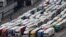 Freight lorries queue as they wait to enter the port of Dover on the south coast of England, Dec. 10, 2020, before boarding a ferry to Europe. 