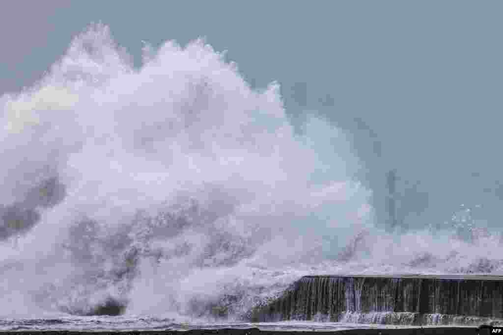 Strong waves break along the coast as Typhoon Kong-rey approaches Taiwan, in Yilan County.