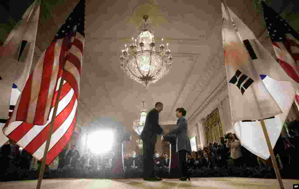 President Barack Obama and South Korea President Park Geun-Hye shake hands at the end of a news conference in the East Room of the White House in Washington, May 7, 2013.