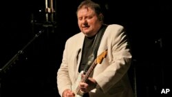 Greg Lake, singer, songwriter and bassist for legendary British rock bands King Crimson and Emerson, Lake and Palmer, performs at the Variety Playhouse in Atlanta, April 26, 2012. Lake died Dec. 7, 2016, at age 69.