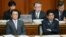 Japanese Prime Minister Shinzo Abe (R) and Finance Minister Taro Aso (L) show their sour faces at the Upper House's plenary session at the National Diet in Tokyo, February 6, 2013.