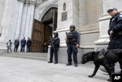 A larger-than-usual security presence is seen at St. Patrick's Cathedral in New York, April 18, 2019.