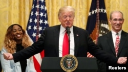 U.S. President Donald Trump holds a news conference to mark six months since the passage of the Tax Cuts and Jobs Act, in the White House East Room in Washington, June 29, 2018.