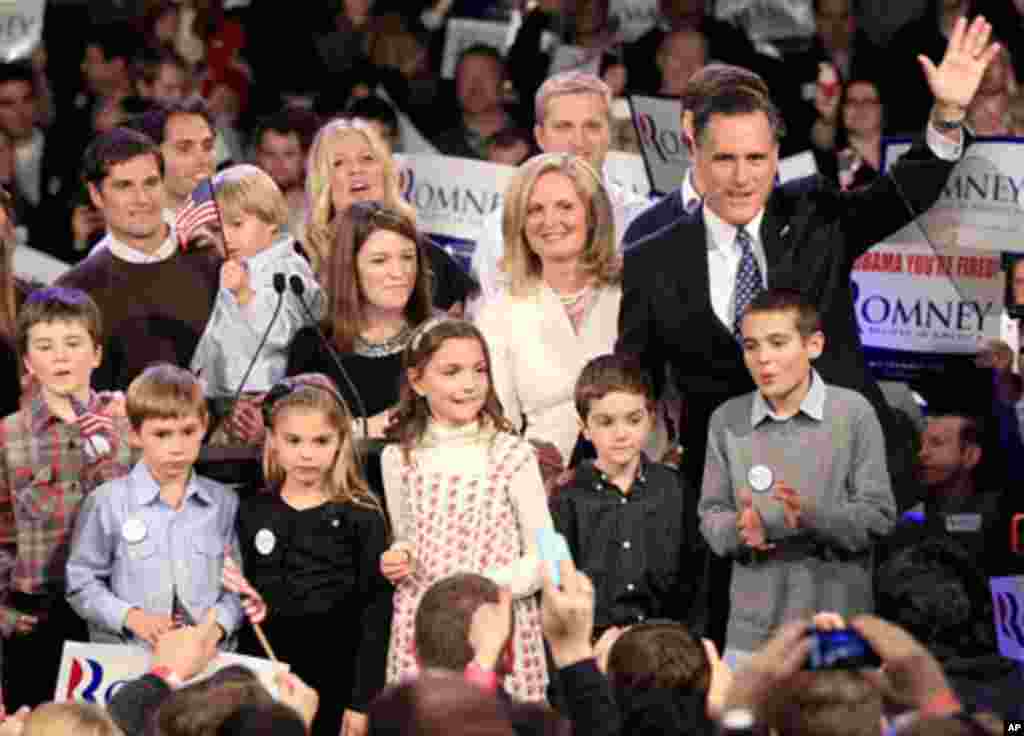 Republican candidate Mitt Romney and his family wave at supporters at his New Hampshire primary night rally, January 10, 2012. (Reuters)