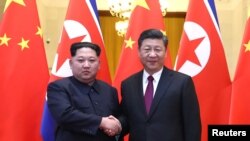 中国国家主席习近平与朝鲜领导人金正恩在北京会晤