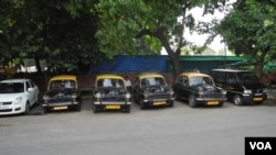 Ambassador taxis parked in a row.