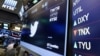 FILE - The Twitter symbol appears above a trading post on the floor of the New York Stock Exchange, July 27, 2016. Twitter’s stock soared following a report Friday that it may be moving closer to selling the business.