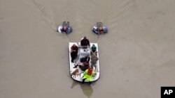 Residents evacuate their homes near the Addicks Reservoir, Houston