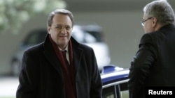 Russia's Deputy Foreign Minister Mikhail Bogdanov (L) arrives at the United Nations European headquarters in Geneva, January 11, 2013.