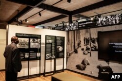 A visitor stands by the permanent exhibition during the official opening of the Johannesburg Holocaust & Genocide Center in Johannesburg, March 14, 2019.