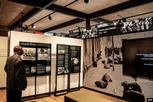 A visitor stands by the permanent exhibition during the official opening of the Johannesburg Holocaust & Genocide Center in Johannesburg, March 14, 2019.